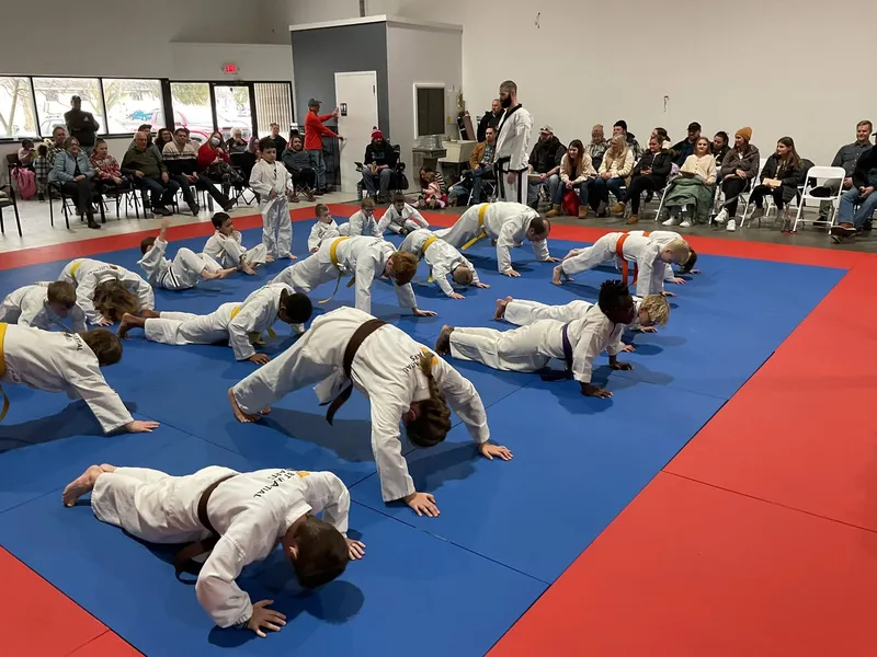 Youth students drilling Taekwondo technique