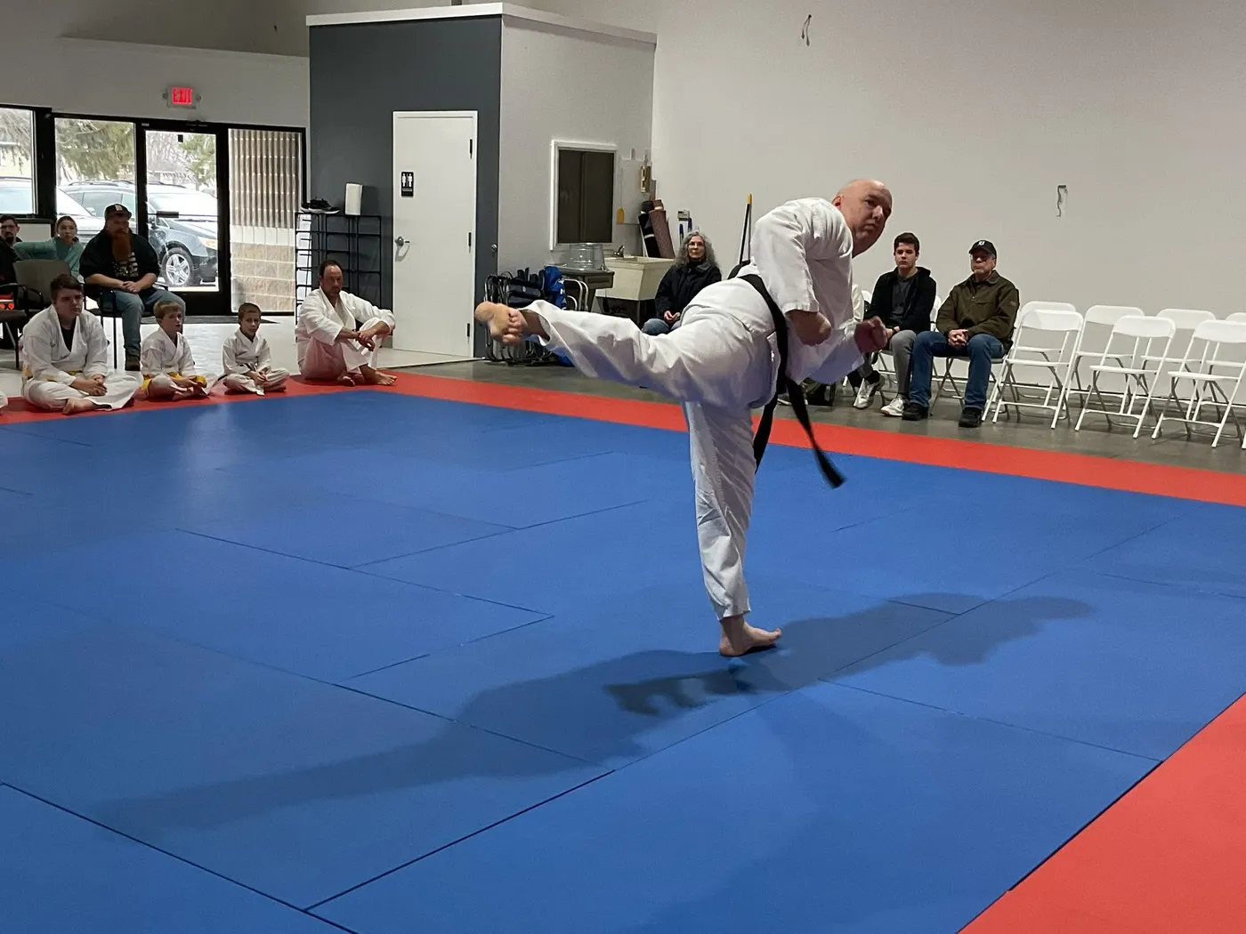 Teen student training a kick